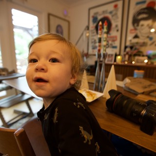 Curious Toddler at Holiday Dinner Table