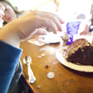 Child Enjoying Chocolate Cake at Madonna Inn