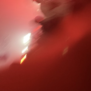 Motion Blur Silhouette in Red Concert Lighting