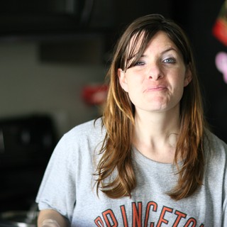 Candid Kitchen Portrait of a Thoughtful Woman