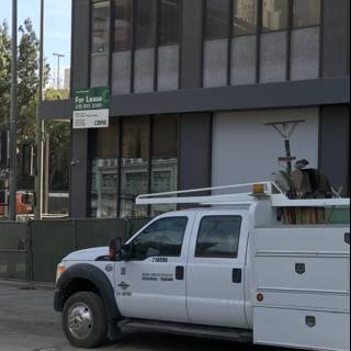 White Pickup Truck Parked in Front of Building