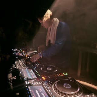 DJ Performance at London Nightclub with Professional Equipment