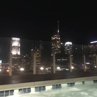 City Skyline at Night from Rooftop Pool