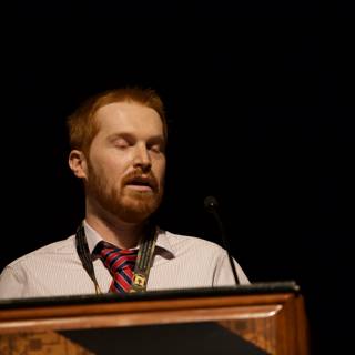Red-bearded Man Addresses a Crowd