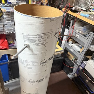 Industrial Cardboard Form Tube in Cluttered Workshop