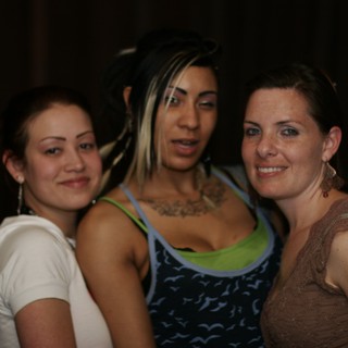 Three Friends Celebrate at Nightclub Anniversary Party