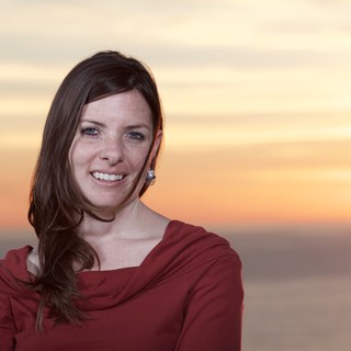 Smiling Woman in Red at Golden Sunset