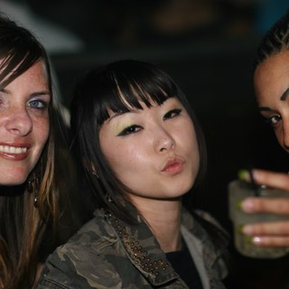 Three Friends Posing at a Night Club Party