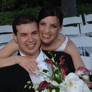 Joyful Newlyweds Embrace at Outdoor Wedding Ceremony