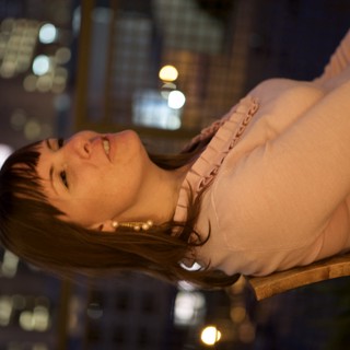 Penelope Gazing Upward Against City Night Lights
