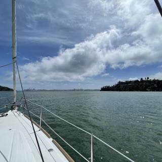 Serene Sailboats in the Cloudy Horizon