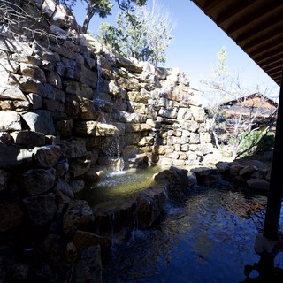 Natural Stone Waterfall and Pool in Tranquil Garden Setting