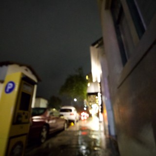 Rainy Night Street Scene in Urban Downtown