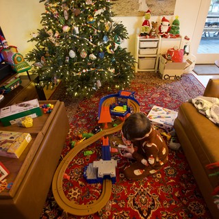 Child Playing with Train Set on Christmas Morning