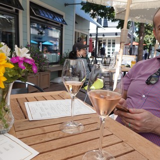 Outdoor Wine Tasting on Sunny Restaurant Patio