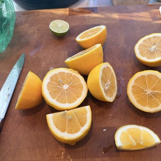 Freshly Cut Citrus Fruits on Wooden Cutting Board