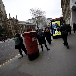 Urban Street Scene with Historic Church and Red Postbox