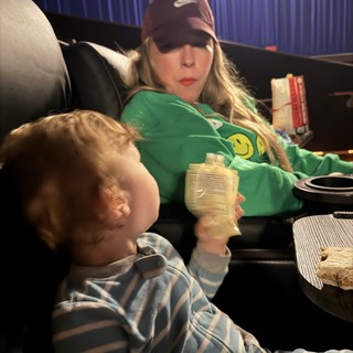 Cozy Movie Night: Mother and Child Relaxing Together