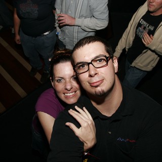 Dave and Penelope Pose at a Nighttime Event