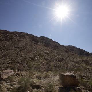 Radiant Sun over Rocky Wilderness