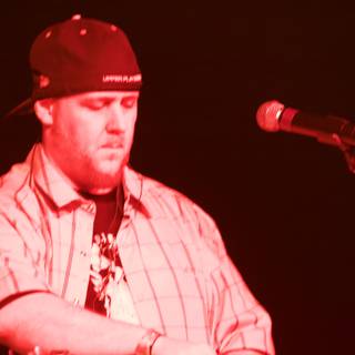Baseball Cap-wearing Singer Performs at 2008 Coachella Music Festival