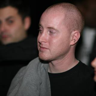 Bald-headed Michael in Black Shirt