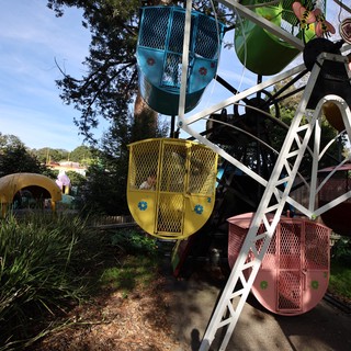 Colorful Ferris Wheel Gondolas at Fantasyland Amusement Park