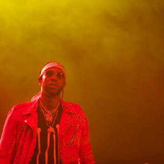 2 Chainz Rocks the Stage in Maroon Sweater and Red Jacket