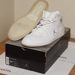 Classic White Sneakers on Top of a Box