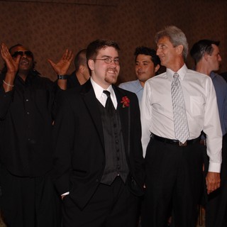 Groom and Groomsmen Celebrate at Wedding Reception