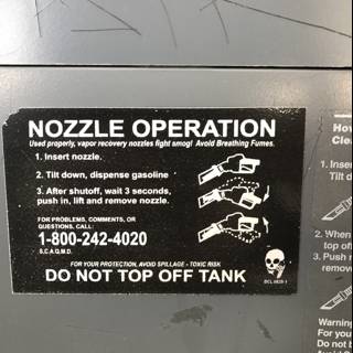 Nozzle Operation Sign on Metal Box