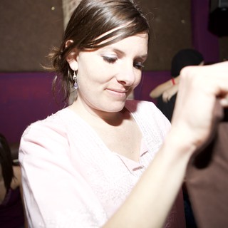 Woman Dancing at Dimly Lit Nightclub Event