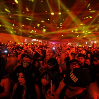 Massive Crowd Surges Under Laser Light Show