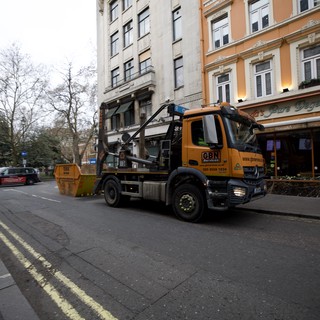 Skip Lorry Making Collection on London Street