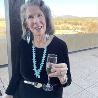 Rhoda B enjoying a glass of wine with a view