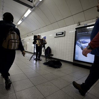 Street Musician Performing in London Underground Station