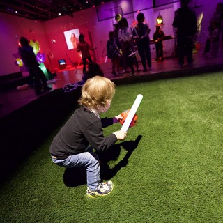 Child with Light Stick at Baby Rave Event