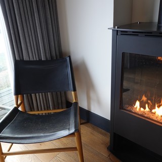 Cozy Fireside Reading Nook with Modern Stove