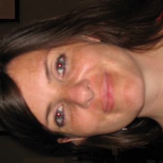 Smiling Woman with Red-Eye Effect in Warm Portrait