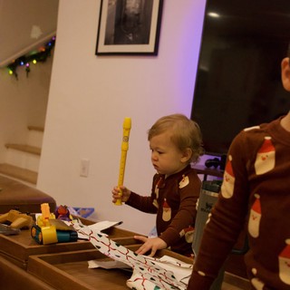 Toddler Playing Yellow Recorder at Christmas
