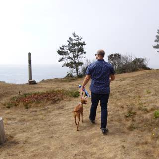 Man and Dog Take a Stroll in Nature