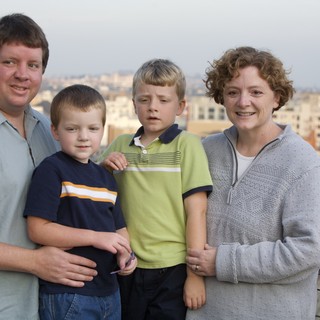 Family Portrait on Urban Rooftop at Dusk