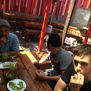 Three Men Lunching at a Cafe