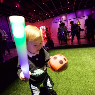 Child with Glow Stick at Baby Rave Event