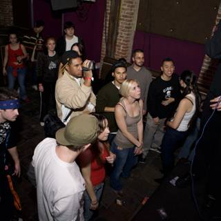 Urban Music Performer Captivates Crowd at Night Club