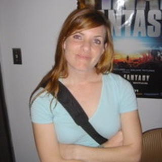 Young Woman Posing Casually in Front of Movie Poster