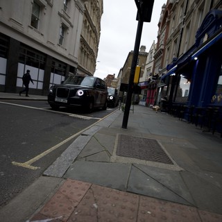 Low Angle Street View of London with Black Cab