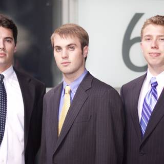 Three Men in Suits Ready for Business