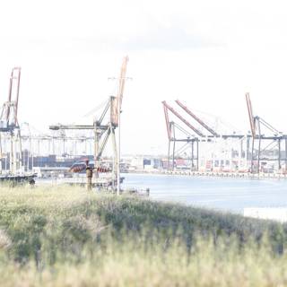 Construction Crane overlooking Waterfront Field