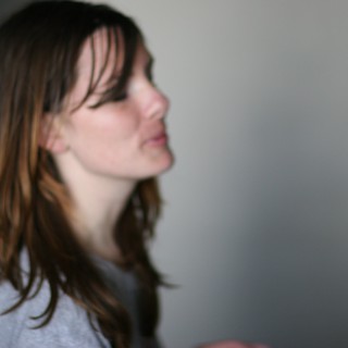 Pensive Profile of a Young Woman in Soft Light